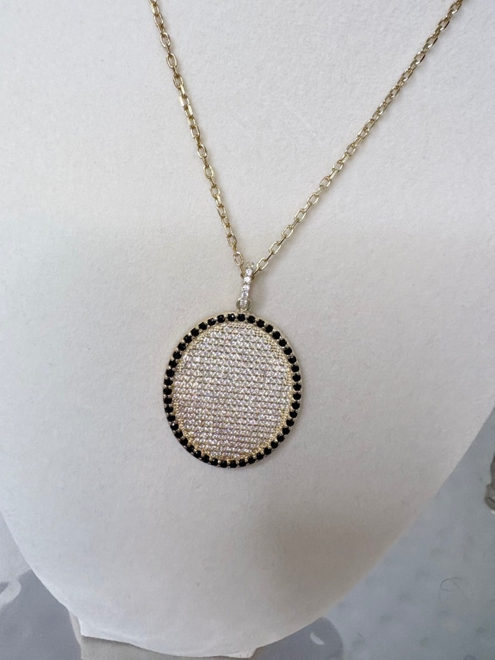Gold medallion with white & black crystals pendant necklace